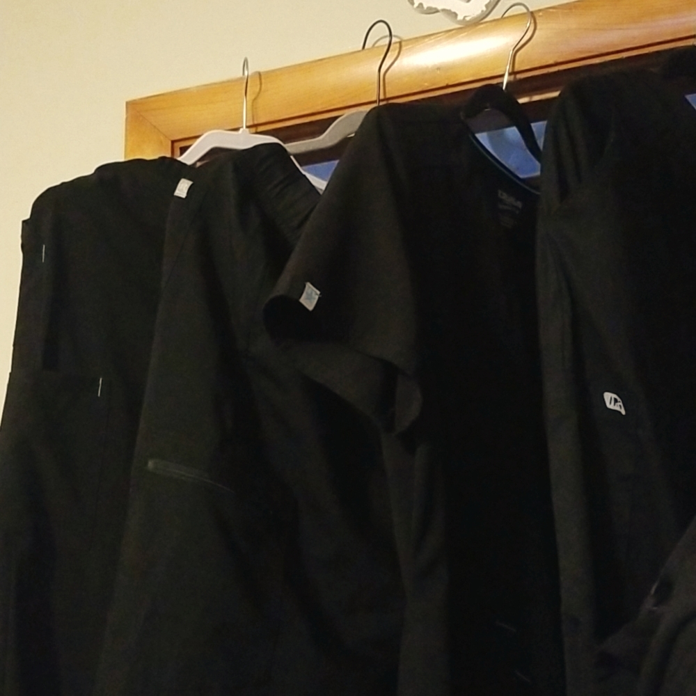 Multiple black scrubs